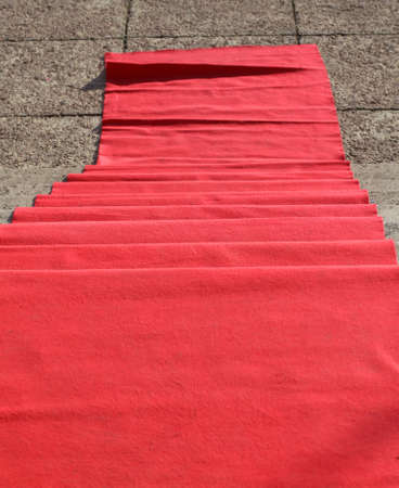 elegant long red carpet on the stairs at the vip fashion eventの写真素材