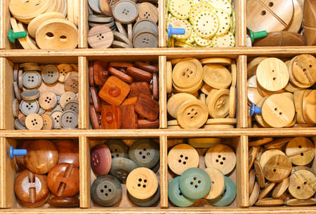 many plastic and wooden buttons  in the shopの写真素材