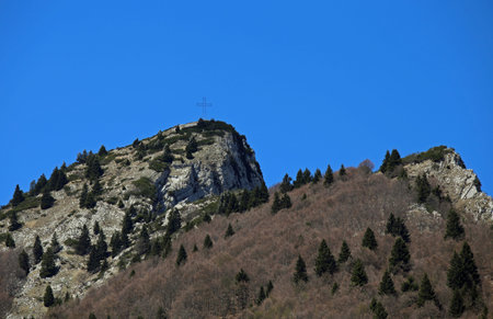 high top of the mountain with the cross and the blue sky