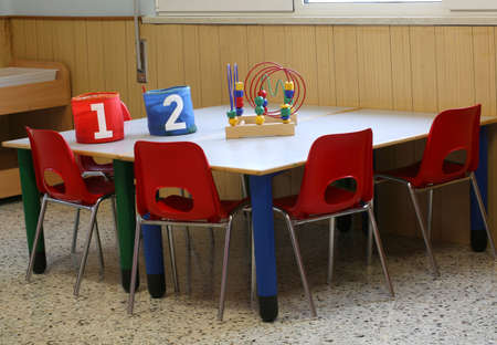 two jars in the school bench in a kindergarten for childrenの写真素材
