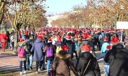 many young people dressed as Santa Claus during the event called Running with Santa Claus at...