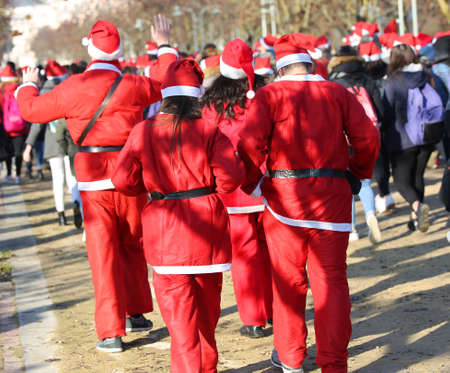 many people dressed as Santa Claus during the event called Running with Santa Claus at Christmasの写真素材