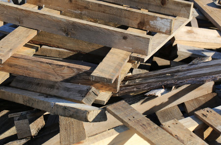 many wooden pallets in a woody material landfillの写真素材
