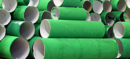 heap of many colorful green cardboard rollsの写真素材