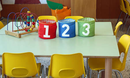 Three jar with big writing 1 2 3 into a kindergarten classroomの写真素材