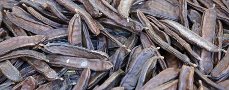 basket of ripe pods for sale at the greengrocerの写真素材