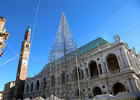old city palace called BASILICA PALLADIANA  in Vicenza in Italy with christmas treeの写真素材