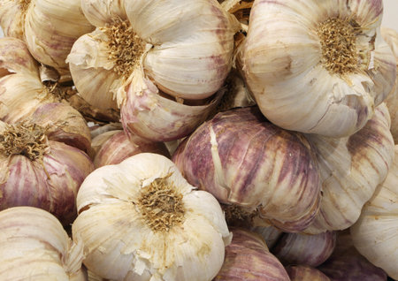 many cloves of garlic for sale at the greengrocer