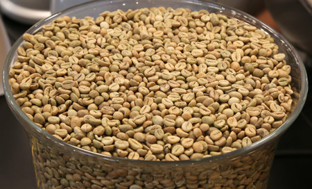 green coffee beans in a large glass bowl