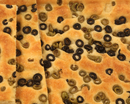 focaccia bread with a lot of typical olives from the Mediterranean Sea countries