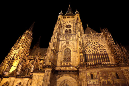 impressive facade of the Gothic cathedral of St. Vitus in Prague in the Czech Republic by nightの写真素材