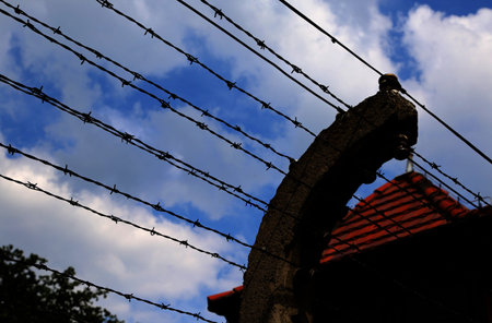 long barbed wire fence in a European prison camp