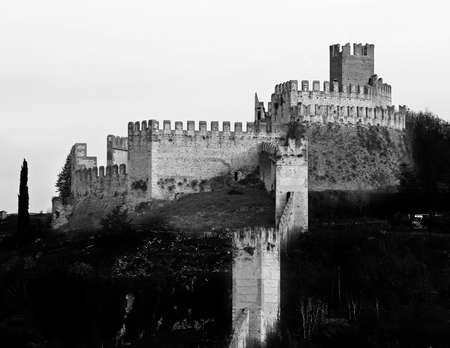 Ancient Castle of Soave with medieval walls and the ancient tower in Province of Verona Italyのeditorial素材