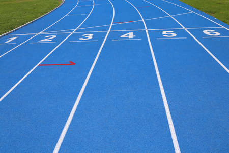 lanes of a athletic track with numbers one two three four five sixの写真素材