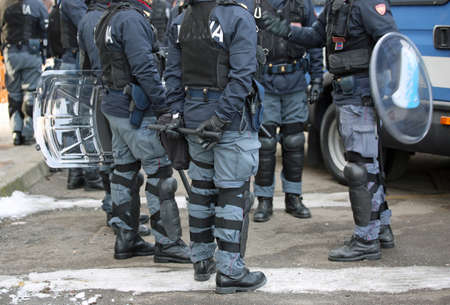 Vicenza, VI, Italy - January 28, 2017: Italian police riot squad with body armor while patrolling the city before the arrival of fans of a football gameのeditorial素材