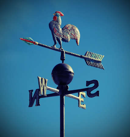 wind weathervane that marks the way forwardの写真素材