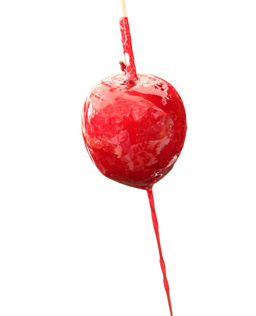 red apple with caramelized sugar syrup on white background