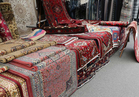 many carpets for sale in the ethnic market stallの写真素材