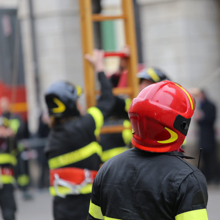 firefighter with uniform and hardhat during outdoor exercise