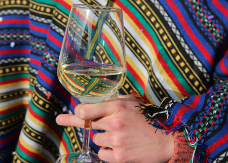 almost full glass with hand of a young boy