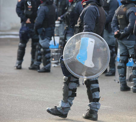 police in riot gear during the anti-terrorism control in the cityの写真素材