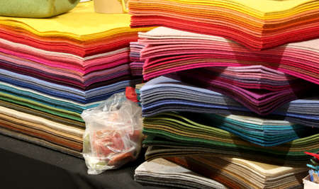 pile of fabrics and of felt for sale in the haberdashery and hobby shopの写真素材