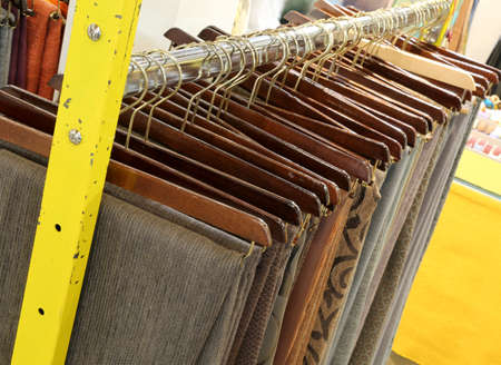 clothes hanging for sale in fashion storeの写真素材