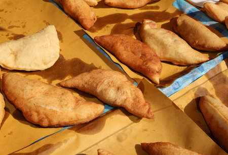 Italian Cuisine with stuffed fried bread called Panzerotti or Pizza Puff with tomato and cheeseの写真素材