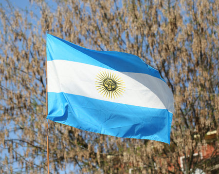 flag of Argentina flying with blue and white stripesの写真素材