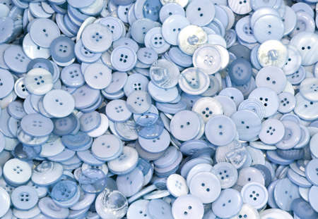 background of thousands button in the store in light blue colorの写真素材