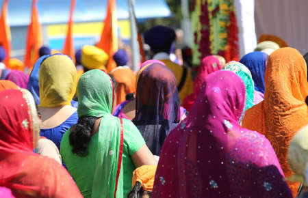 Vicenza, Vi, Italy - April 8, 2017: women with colorful clothes and veils to cover their heads during the religion festival in city street duringのeditorial素材