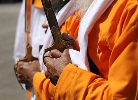 Vicenza, Vi, Italy - April 8, 2017: hand of the elderly Sikh man with ceremonial scimitar during the Nagar Kirtan festivalのeditorial素材