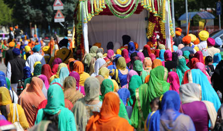 Vicenza, VI, Italy - April 8, 2017: many people Sikh procession pray during a religious ceremony Nagar Kirtan festival on the roadのeditorial素材