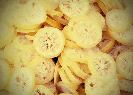 background of many slices of dried mediterranean lemonsの写真素材