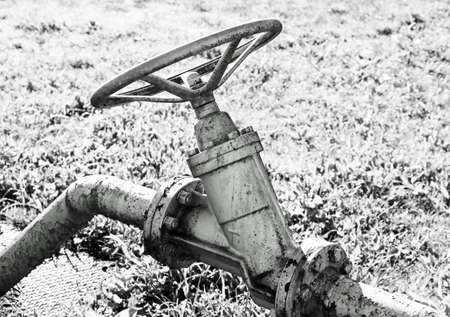 huge old shut-off valve to close the gasの写真素材