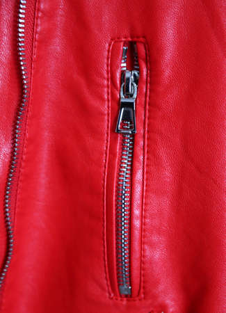 Glittering zipper on the red leather jacketの写真素材