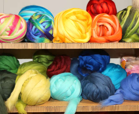 sale of balls of soft wool on the shelves of haberdasheryの写真素材