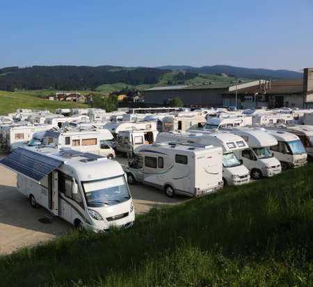 Asiago, VI, Italy - May 27, 2017: motorhome and caravan in the wide parking  after the cycling race called Giro di Italiaのeditorial素材