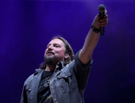 Bassano del Grappa, VI, Italy - April 29, 2017: Cilloni Yuri with the microphone is the vocalist of Nomadi an famous Italian Musical Band on the stage during the live concert in Italyのeditorial素材