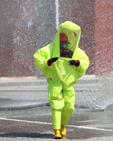 Man with a Yellow protective suit against chemical and bacteriological agentsの写真素材