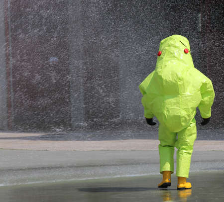 person with protective clothing against chemical and biological agents during an outdoor exerciseの写真素材