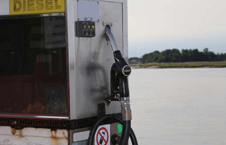 Old gas pump for filling ships near the harborの写真素材