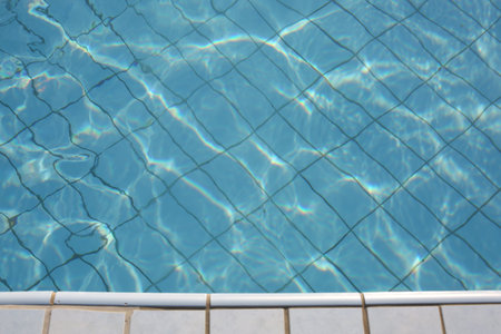 Pool edge with heated pool water at controlled temperature in the resort