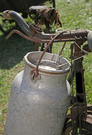 Antique milk can aluminum on the bicycle of the cheese maker