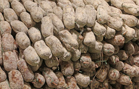 lots of salami for sale in delicatessenの写真素材