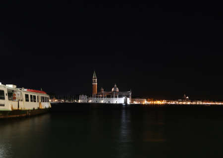 Church of Saint Geroge in the Venetian lagoon by night and the boat moved by Adriatic Seaの写真素材