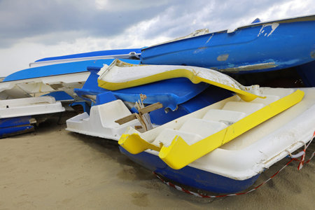 many destroyed boats after landing illegal immigrants on the sandy beach