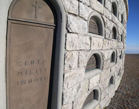 Vicenza, VI, Italy - December 8, 2015: War Memorial of First War World called Ossario Monte Grappa. Graves of italian fallen soldiers and headstone with text that means One hundred of unknown soldiersのeditorial素材