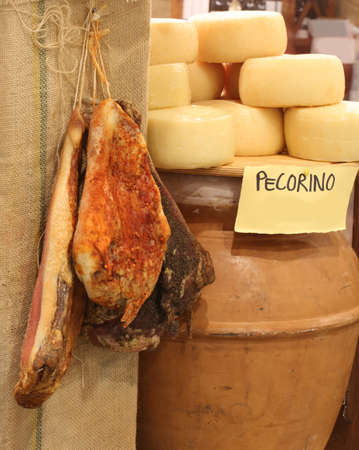 salami and PECORINO cheeses in the shop of typical Italian productsの写真素材