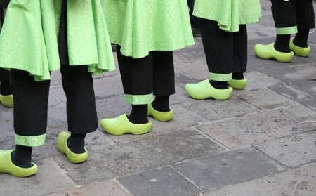 so many Dutch people with green clogs and black trousersの写真素材